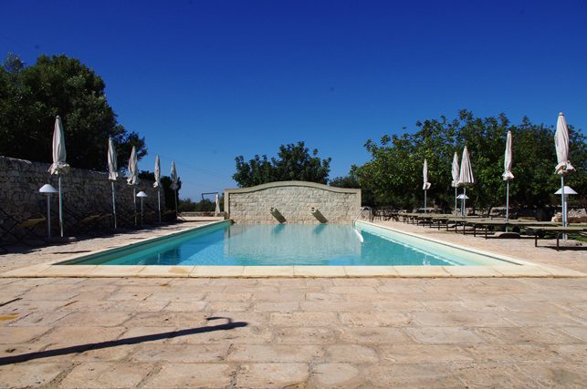 relaxing by the pool at masseria ciancio